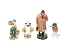 A group of four assorted porcelain figurines.