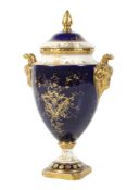 A Coalport 20th century urn and cover.