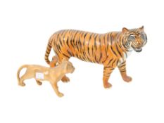 Two Beswick figures of big cats. Consisting of a tiger and a lion cub. Max.