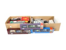 An assortment of 00 gauge locomotive compartments and Lledo diecast vehicles.