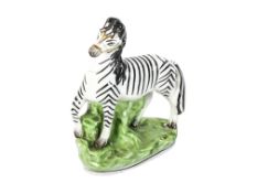 Staffordshire pottery flat back figure modelled as a zebra (AF). H15.