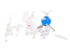 A group of five assorted Swarovski Crystal glass animals.