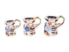 A set of three Victorian graduated ironstone jugs. Max.