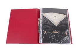 Ring binder of twenty-five assorted crochet and lace textile samples.