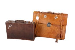 Two vintage leather cases.