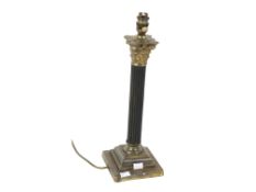 Vintage brass Corinthian column table lamp. Raised on a stepped weighted plinth.