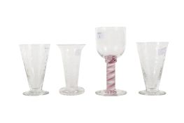 Group of four drinking glasses.