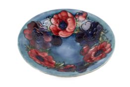 A large Moorcroft dish in the Anemone pattern. Impressed to base and signed, diameter 25cm.