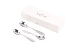 Three Georg Jensen 'Mitra' stainless steel spoons, in a Georg Jensen box.