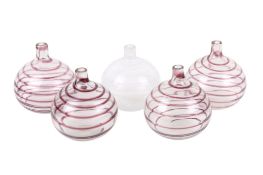 Five Murano style hand blown glass 'onion' bottle vases with spiral decoration.