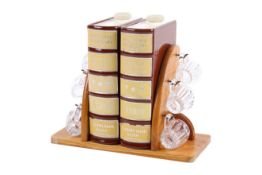 A set of two mid-century West German pottery spirit flasks in the form of books.