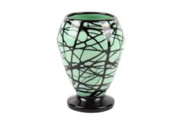 A Georges Dumoulin (1882-1959) green and black glass vase. Of baluster form with a round base. H19.