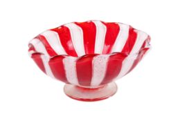 A mid-century red and white glass footed bowl in a Murano style.