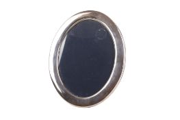 An oval silver framed picture frame.