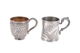 Two 19th century and later silver and white metal mugs.