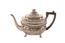 A George III silver teapot.