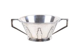 An Art Deco silver twin-handled cup.