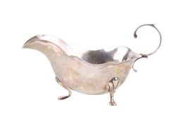 A Victorian silver sauce boat.