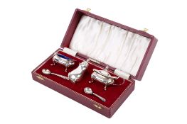 A five-piece silver cruet set.