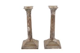 A pair of Victorian silver candlesticks.