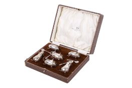 A silver Walker & Hall cruet set.