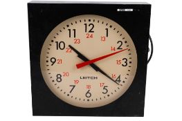 A vintage Leitch Studio electric wall clock.