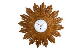 A vintage starburst wall clock.