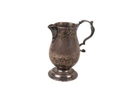 A late 18th/early 19th century silver jug.