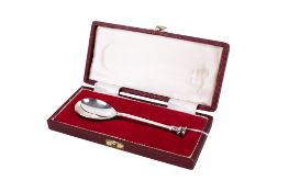 A silver seal top spoon.