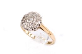 A hallmarked 18ct gold diamond ring. Set with round brilliant and single cut diamonds of 0.