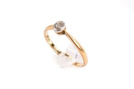 An 18ct gold (tested) single stone diamond ring. Set with an old mine cut diamond of 0.