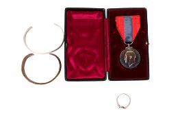 A small group of collectables, including a medal.