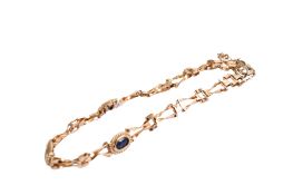 A hallmarked 9ct gold panel bracelet. Set with three small oval opal triplets. L17.