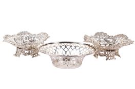 Three small pierced silver dishes.