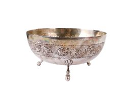 A Cypriot silver bowl with stippled leaf border.