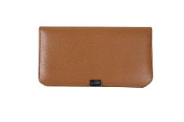 A Smythson of Bond Street tan leather purse.