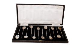 A set of twelve Art Deco silver coffee bean spoons.