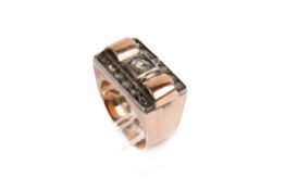 A 9ct gold (tested) and diamond ring. Set with 13 diamonds, the central diamond circa 3.