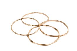 Four 9ct gold bangles. Of similar twisted designs, all hallmarked, inner dimension circa 6.
