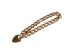 A 9ct gold curb link bracelet. Width of links 8mm, hallmarked to end link and heart lock, L18.