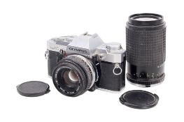 An Olympus OM30 35mm SLR camera outfit. Chrome. Serial number 1140548. Shutter working.