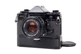 A Canon A-1 35mm SLR camera. Black. Serial number 812891. With a Canon FD 50mm f1.8 lens, optics VG.