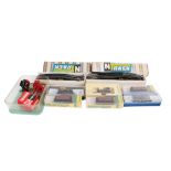 An assortment of N gauge locomotives, wagons and accessories.