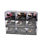 An assortment of Onyx Formula One Driver Helmets in original boxes.