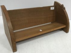 An oak book trough with carved mouse motif by Robert Thompson (The Mouseman) of Kilburn 45 cm wide