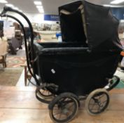 A Victorian white painted wrought iron doll's cot 80cm long x 36cm wide x 50cm high and a circa