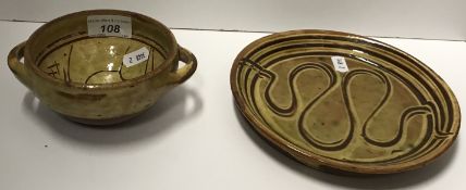 A Michael Cardew glazed terracotta two handled bowl, 15 cm wide including handles,