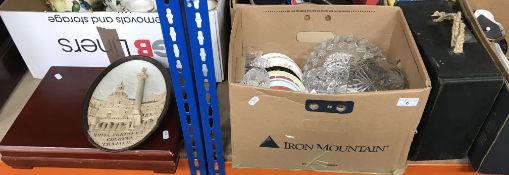 A box containing a Wilhelm Schiller & Sons ceramic relief plaque of oval form,