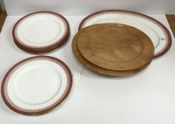 A set of eight pink and gilt decorated dessert plates and matching oval serving plate and two flame
