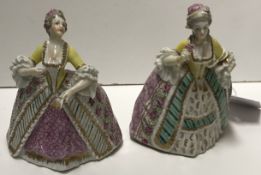 A pair of polychrome decorated porcelain 